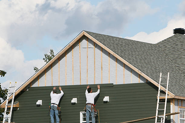 Professional Siding technician working in Mentcle, PA